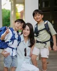 kids coming back from school carrying bags