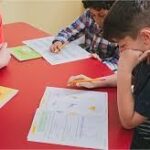 kids solving workbook