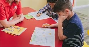 kids solving workbook
