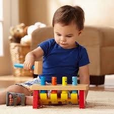kid is playing with pounding table