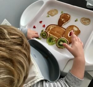 toddler taking breakfast