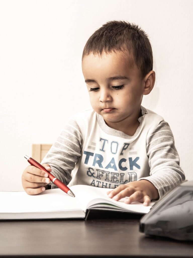 the kid is trying to write