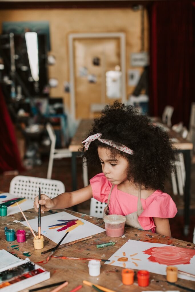 A girl is exploring how to paint